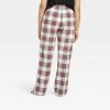 Women's Holiday Tartan Plaid Fleece Matching Family Pajama Pants - Wondershop™ Cream